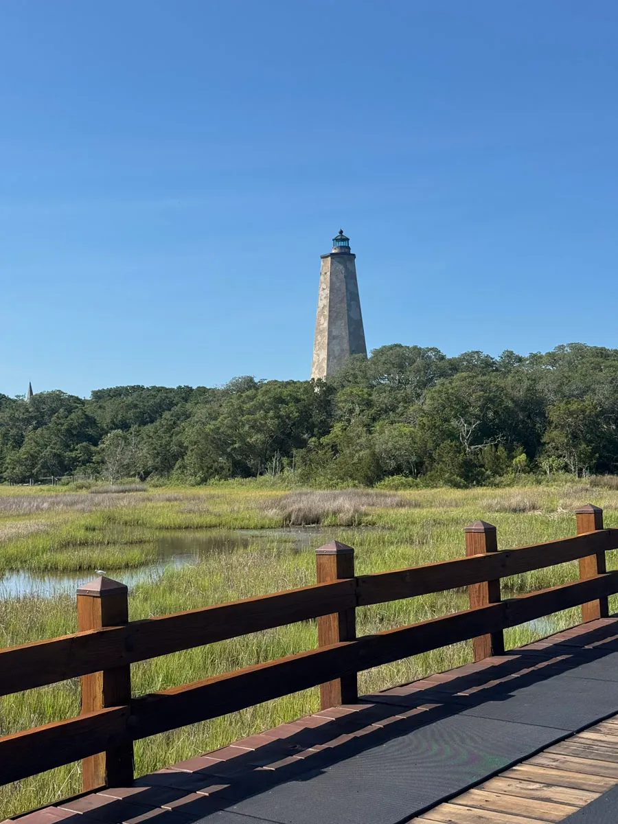 Old Baldy lighthouse over salt marsh from boardwalk railing